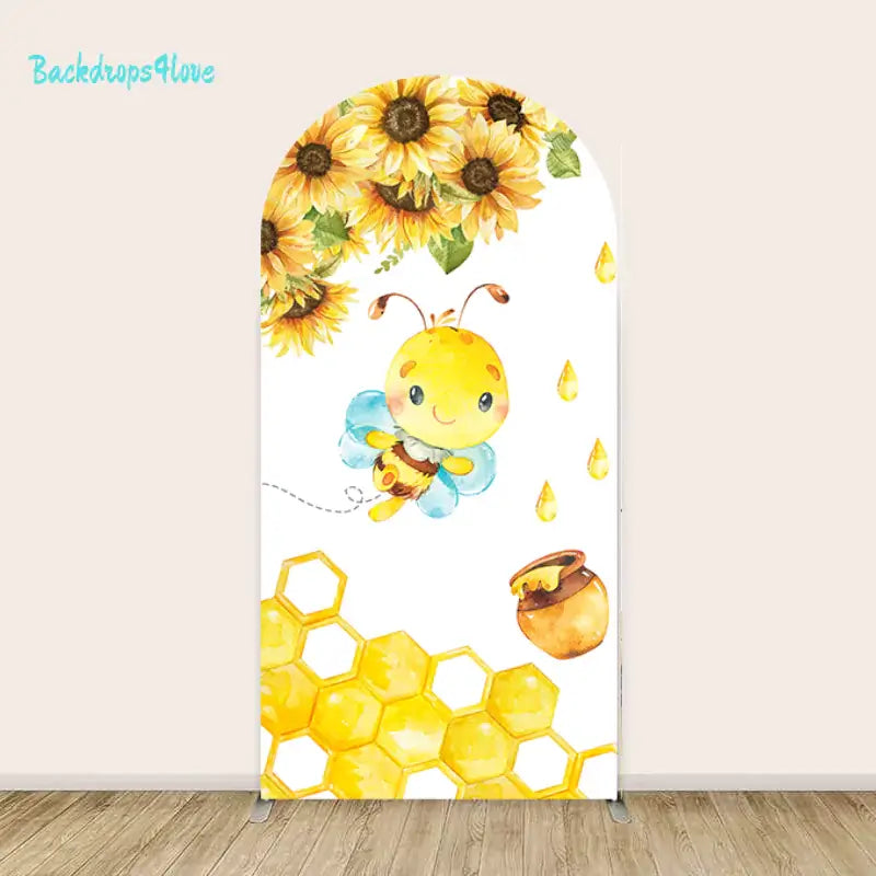 Arched backdrop with a buzzing bee surrounded by sunflowers, honeycomb patterns, and dripping honey details.