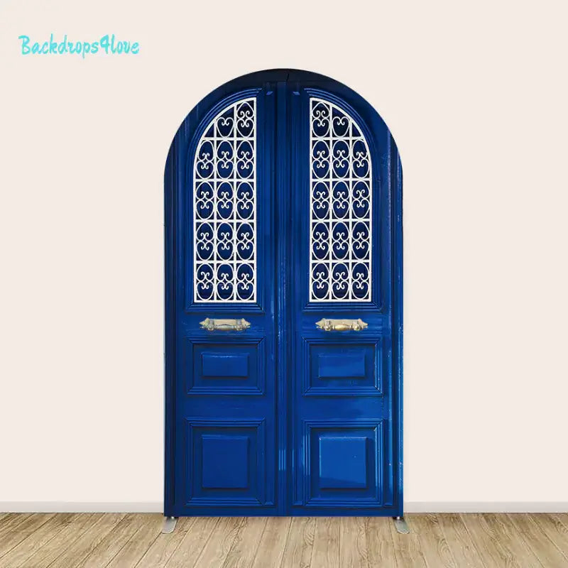 Center arch panel featuring a deep blue double door with arched top and ornate white iron scrollwork.