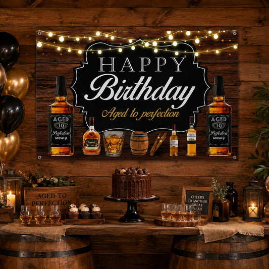 Rustic whiskey birthday backdrop banner with Aged to Perfection lettering, whiskey bottles, barrel, glass and warm string light design for an adult birthday party.