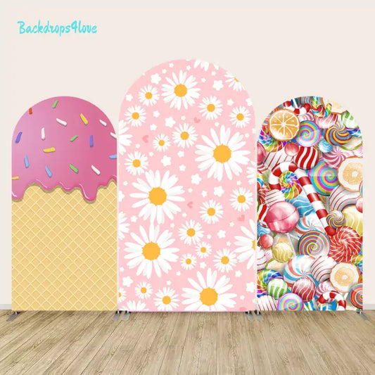 Arch backdrop set with various fun designs including ice cream cone, daisy flowers, and colorful candy