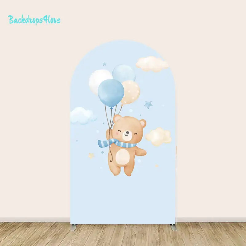 Arched backdrop with a teddy bear floating with pastel balloons against a dreamy blue sky filled with clouds and stars.