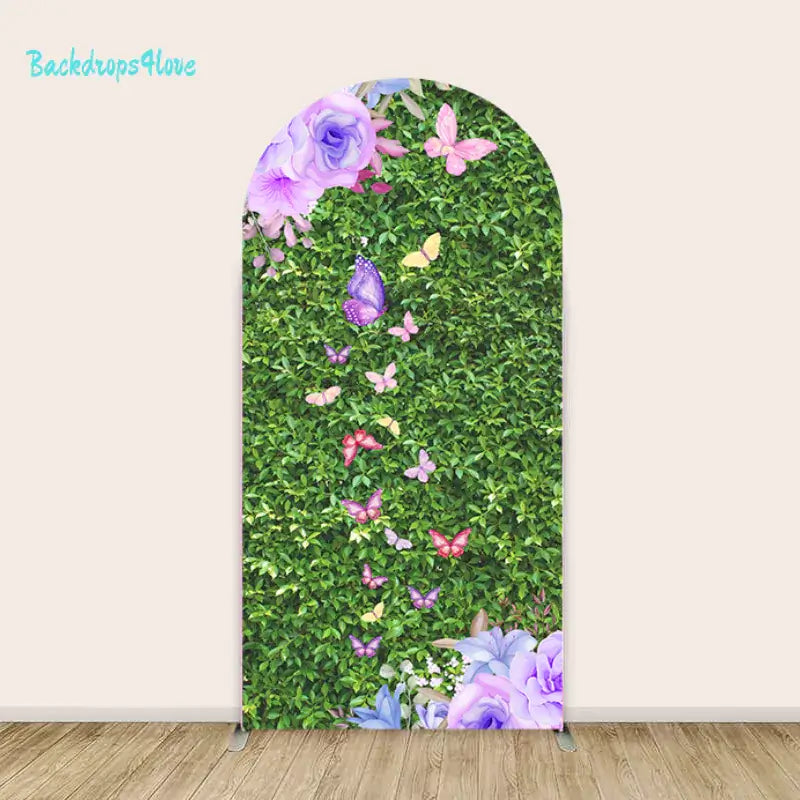 Left arch with lush green leaves and purple butterflies