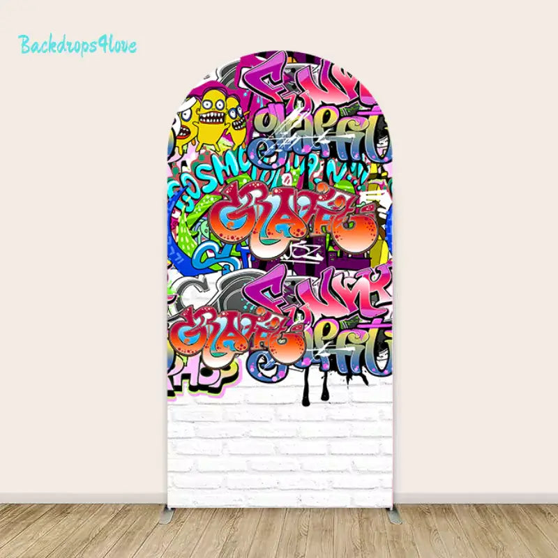 Left panel of the graffiti backdrop set, featuring colorful graffiti art on a white brick wall background.