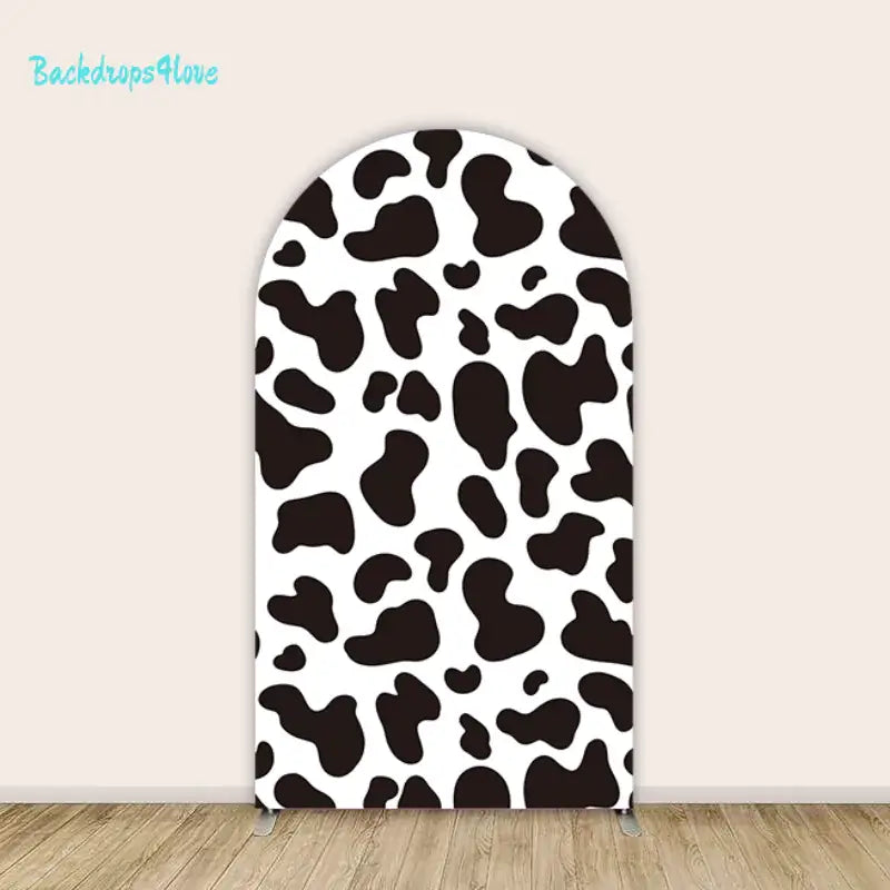 Right arch panel with black and white cow print design.