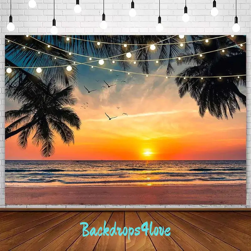 A tropical beach scene backdrop showing a vibrant sunset over the ocean, framed by palm trees and lit with string lights. Seagulls are flying in the colorful sky, making it perfect for beach-themed parties and events