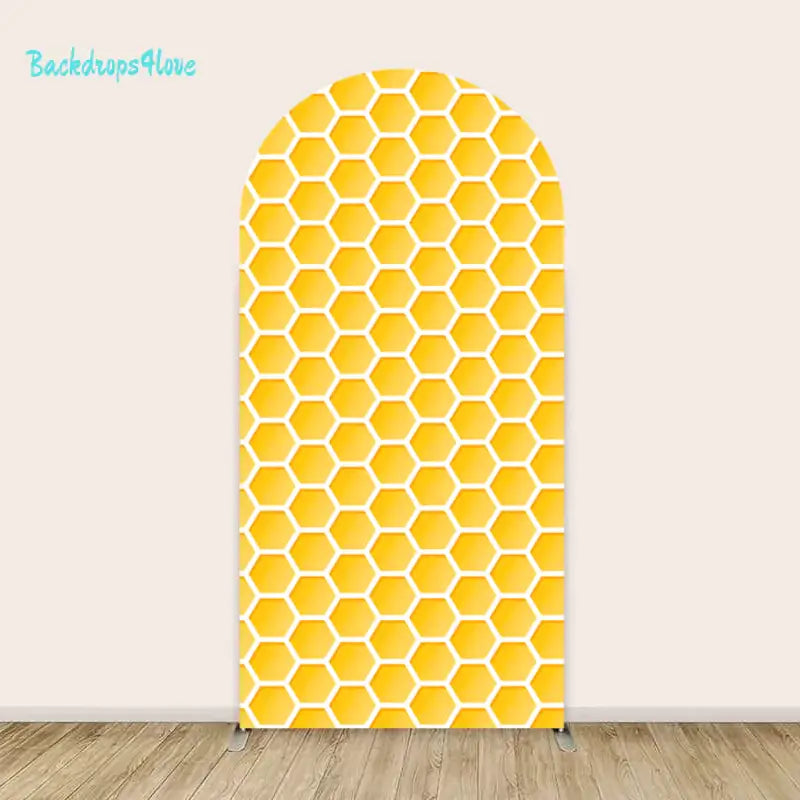 Yellow honeycomb patterned arch backdrop for parties and special occasions