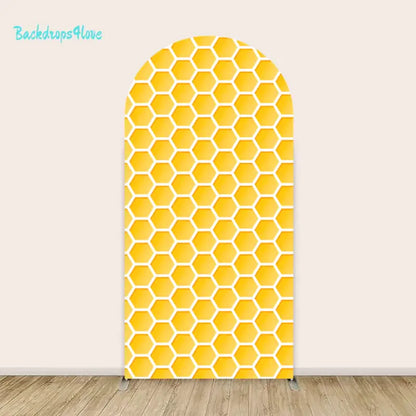 Yellow honeycomb patterned arch backdrop for parties and special occasions