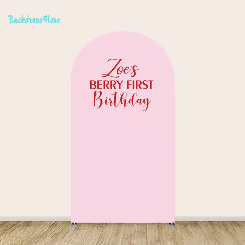 Center arch with text 'Zoe's Berry First Birthday' on a pink background