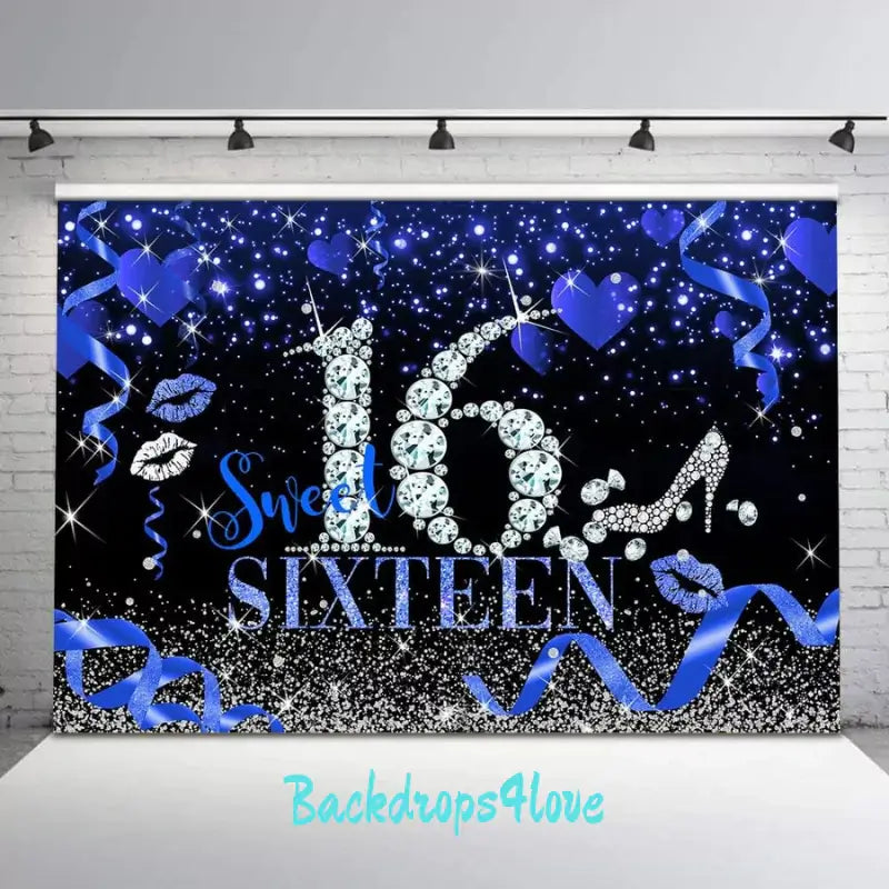 Elegant blue and black Sweet 16 party backdrop featuring sparkling designs and ribbons.