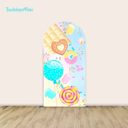 Left arch featuring colorful candy lollipops, chocolate bars, and sprinkled treats in pastel shades.
