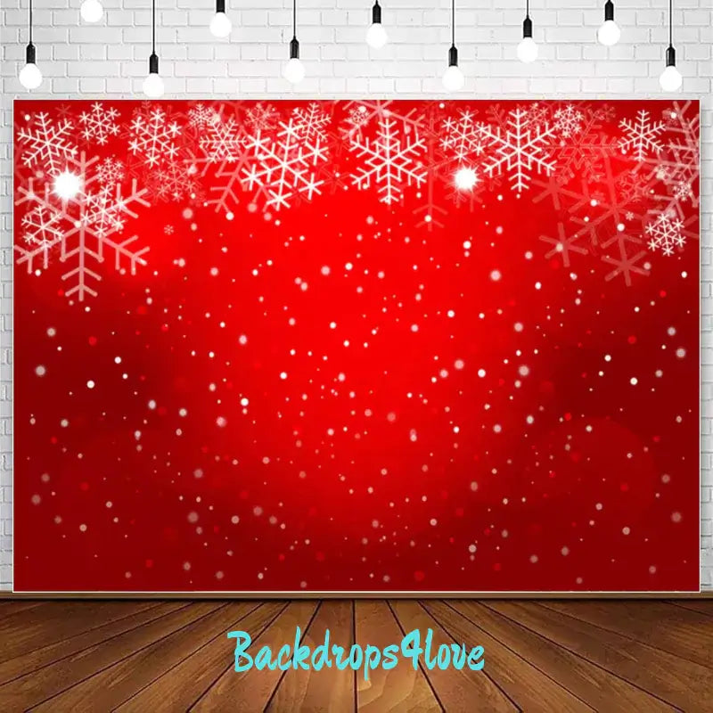 A red backdrop with white snowflakes scattered across the top, creating a festive winter scene. Ideal for Christmas parties, holiday events, and seasonal photo booths