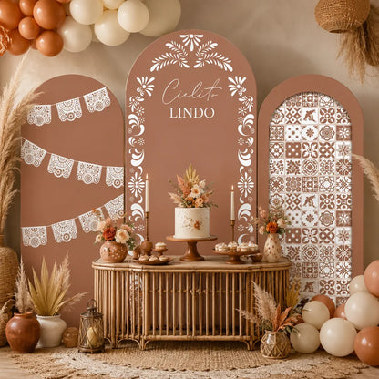 Three-piece Cielito Lindo arch backdrop covers set with terracotta tones, white papel picado designs, floral folk art and Mexican tile patterns.