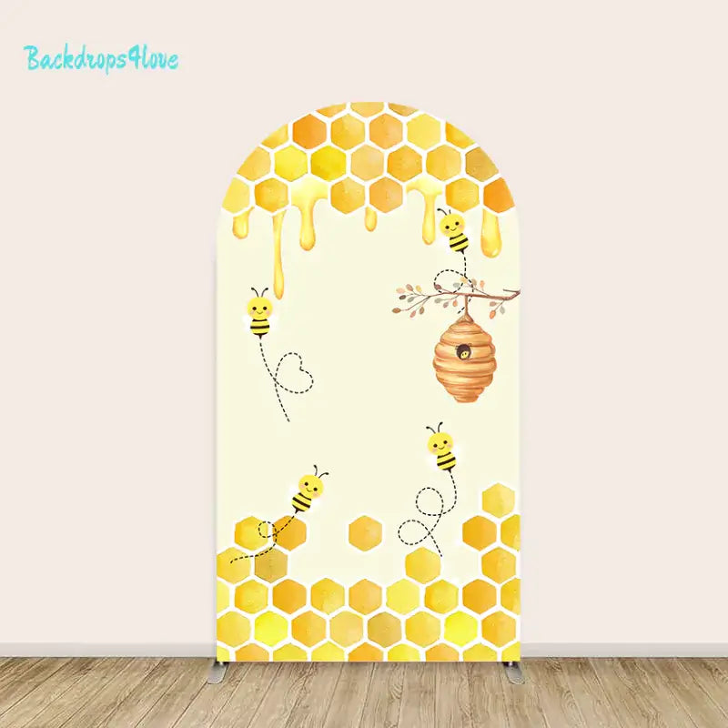 Honey bee and honeycomb arch backdrop with beehive design for celebrations and events