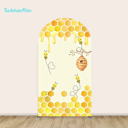 Honey bee and honeycomb arch backdrop with beehive design for celebrations and events