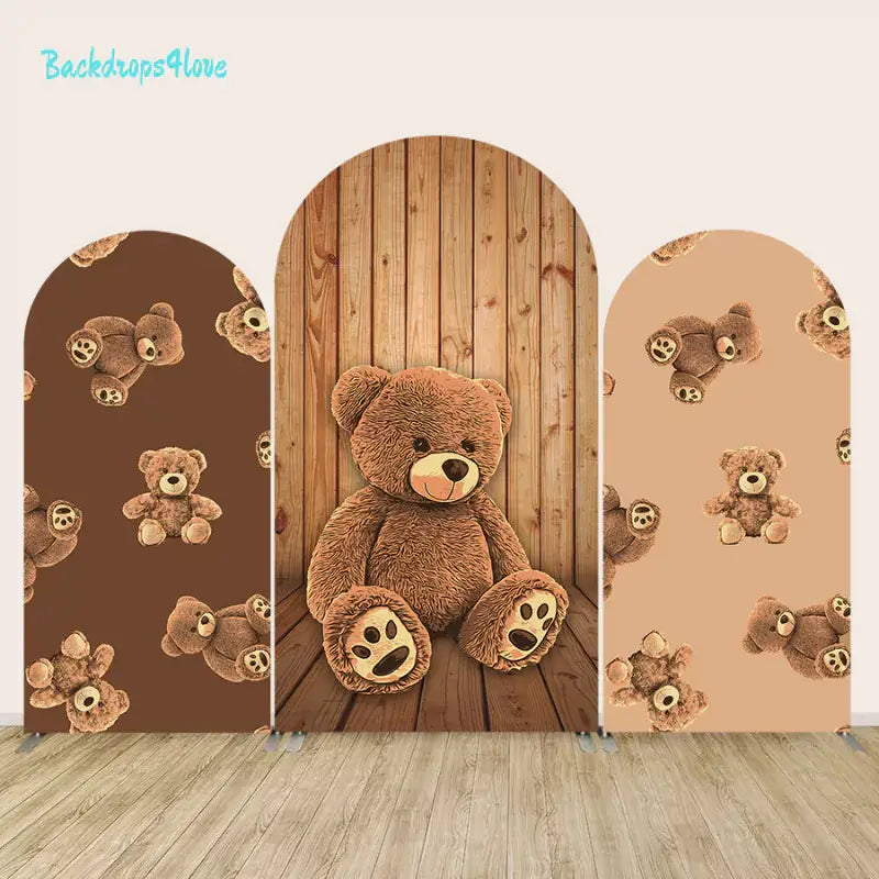 Three-piece arch backdrop set with teddy bear and wood designs in brown tones