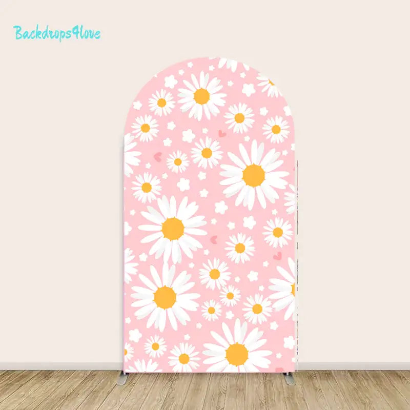 Middle arch displaying white daisies on a pink background with small floral accents