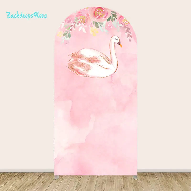 Arched backdrop with a graceful swan in a soft pink watercolor design, accented by floral details.