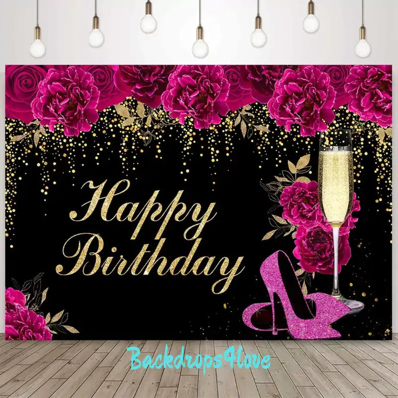 Luxurious birthday party backdrop featuring vibrant flowers, glitter, and high heels.