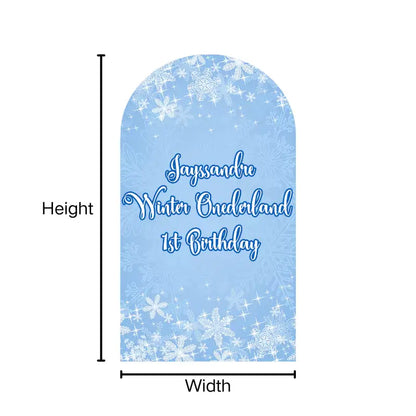 Snowflake-themed Winter Onederland arch backdrop cover with Jayssandre's name, perfect for a 1st birthday celebration