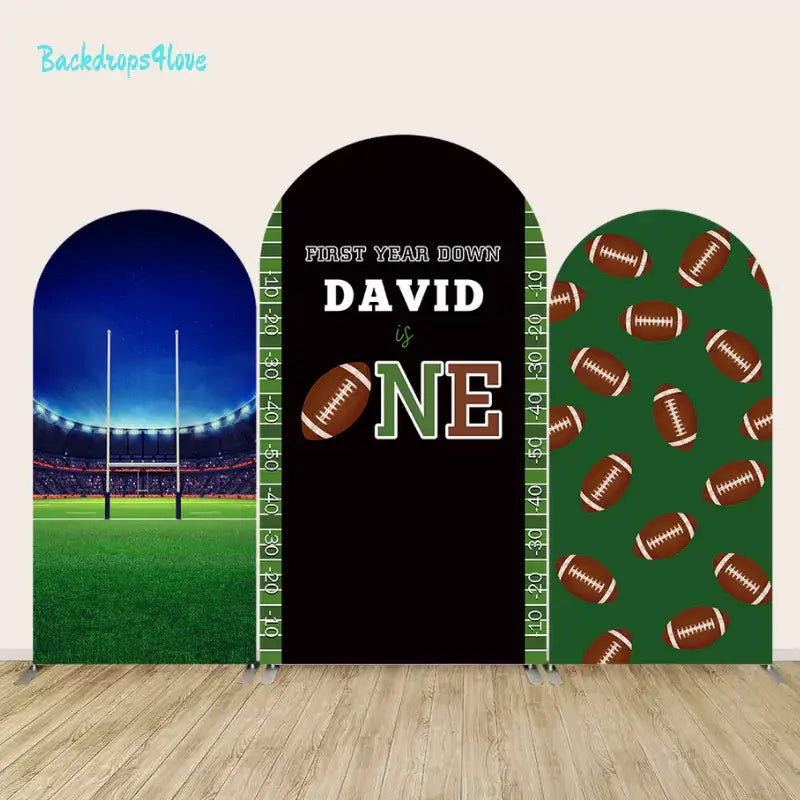 Football-themed first birthday arch backdrop set with stadium, personalized text, and football pattern