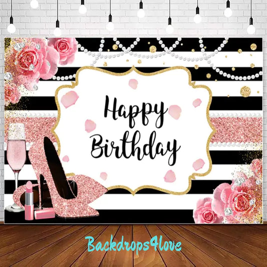 Glamorous 'Happy Birthday' backdrop with black and white stripes, pink glitter shoes, and champagne glass, surrounded by roses, pearls, and gold glitter accents. Perfect for an elegant and stylish birthday celebration or photoshoot backdrop