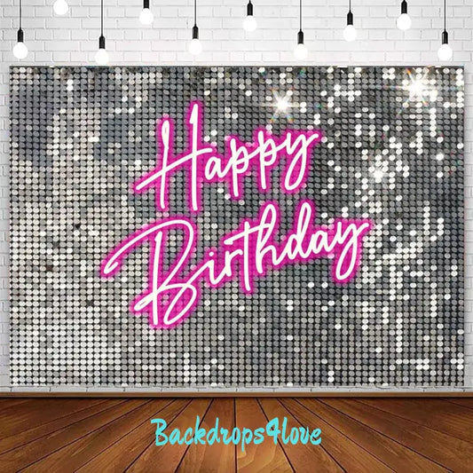 A sparkling silver sequin birthday backdrop with bold pink neon text that reads 'Happy Birthday.' The backdrop is perfect for glamorous and trendy birthday celebrations or photo booths.