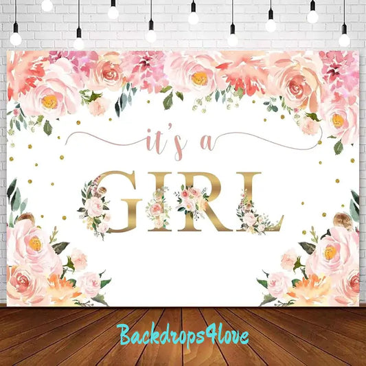 This image displays a baby shower backdrop with the words 'It's a Girl' in gold font at the center, surrounded by delicate pink and peach floral decorations. The backdrop is designed for a baby girl celebration, featuring soft pastel tones and elegant flower motifs, perfect for a baby shower or gender reveal party.