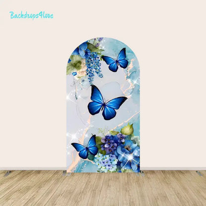 Center arch panel of the blue butterfly backdrop set featuring large blue butterflies, hydrangeas, and a gold-accented marble texture.