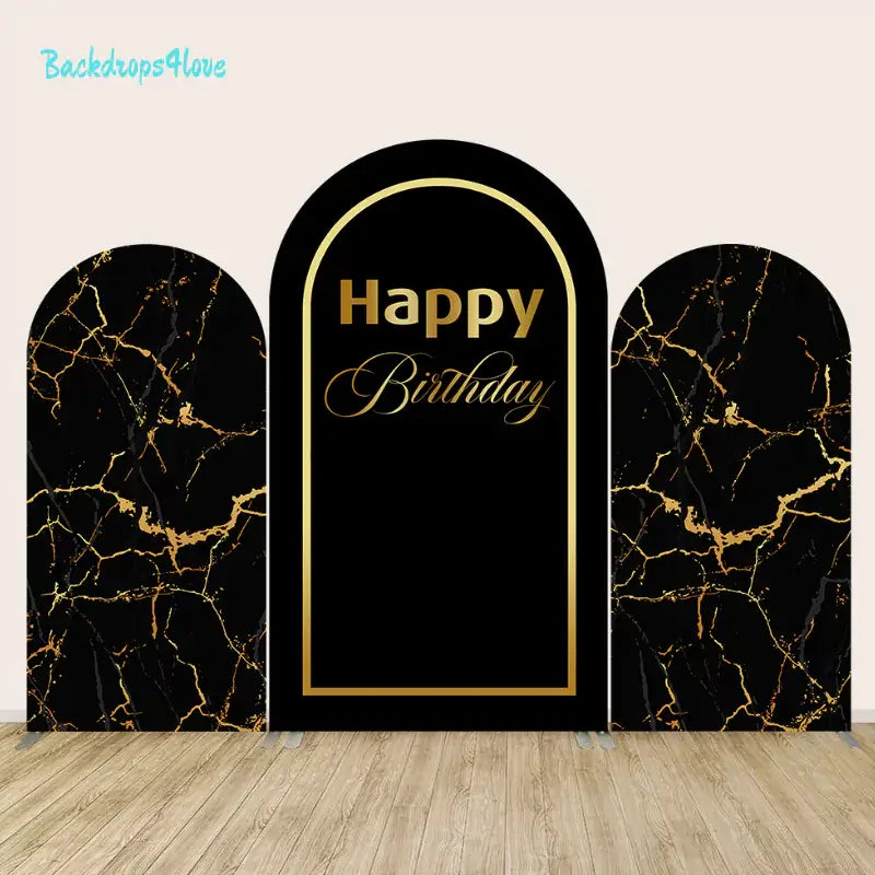 Three-panel black marble-themed backdrop set with gold accents and a central panel with "Happy Birthday" text.