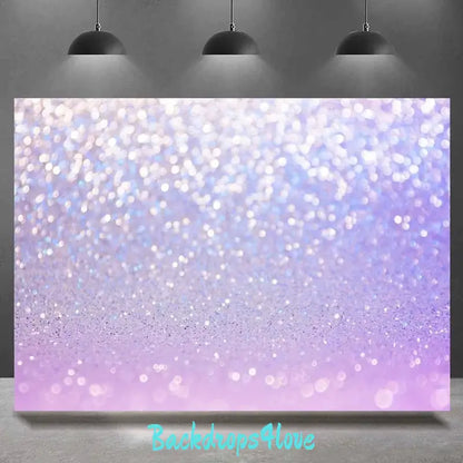 Pastel purple sparkle backdrop with shimmering light effects, perfect for events and photoshoots.