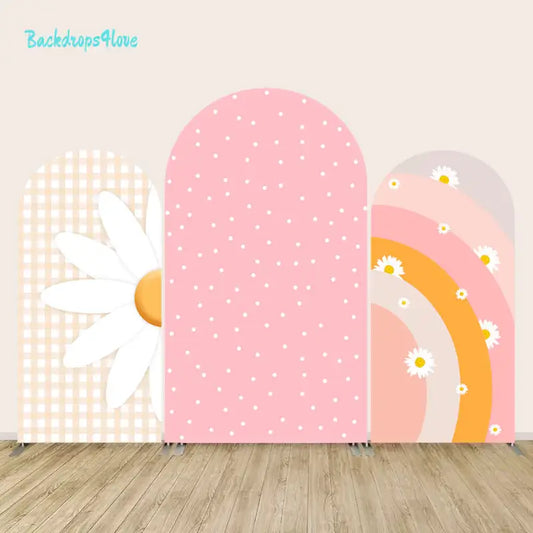 Pastel daisy and rainbow backdrop set ideal for baby showers or girls’ birthdays, combining gingham, polka dots, and a retro-style rainbow design.