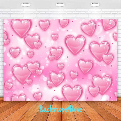 Pink heart backdrop with sparkling heart designs and soft bokeh effect for romantic events.