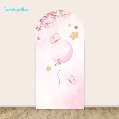 Left arch featuring pink balloon and butterfly with floral borderfloral accents