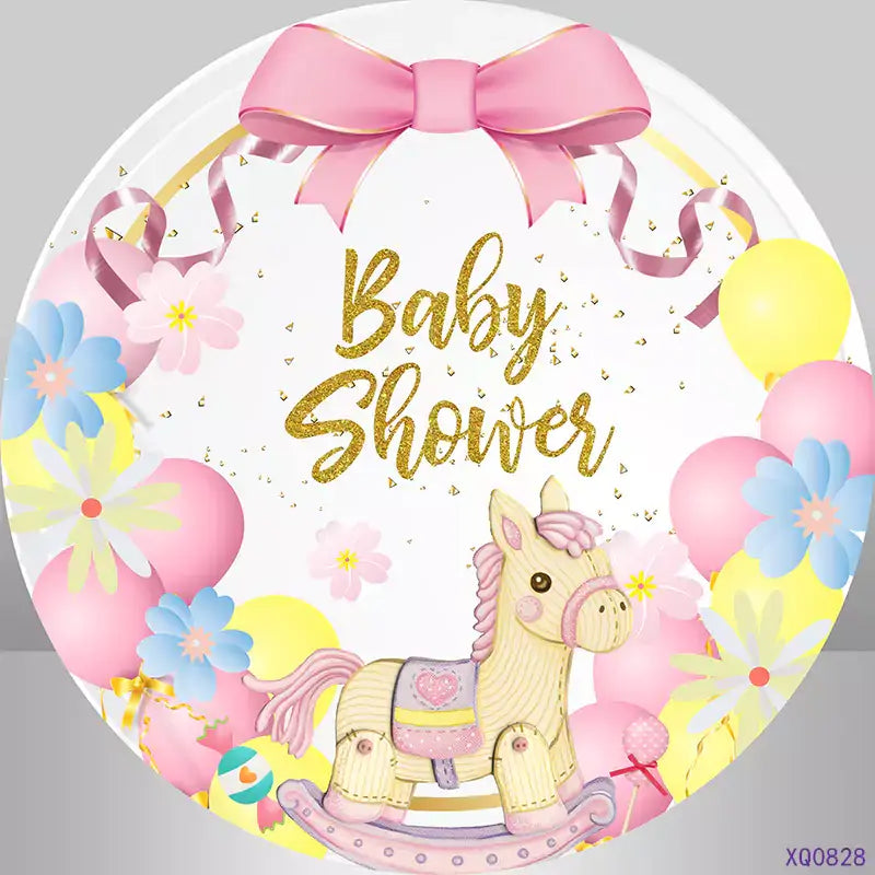 Cute pink and yellow baby shower party backdrop with a rocking horse and colorful decorations, ideal for photoshoots