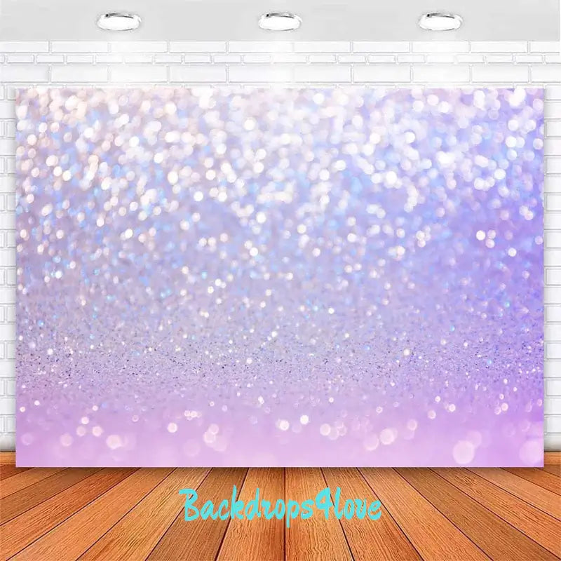 Purple glitter bokeh backdrop with a sparkling gradient design, ideal for photography and party decorations.