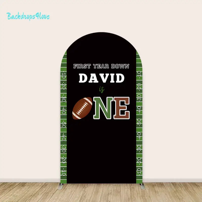 Personalized football-themed arch backdrop with 'First Year Down' and name for birthday celebrations