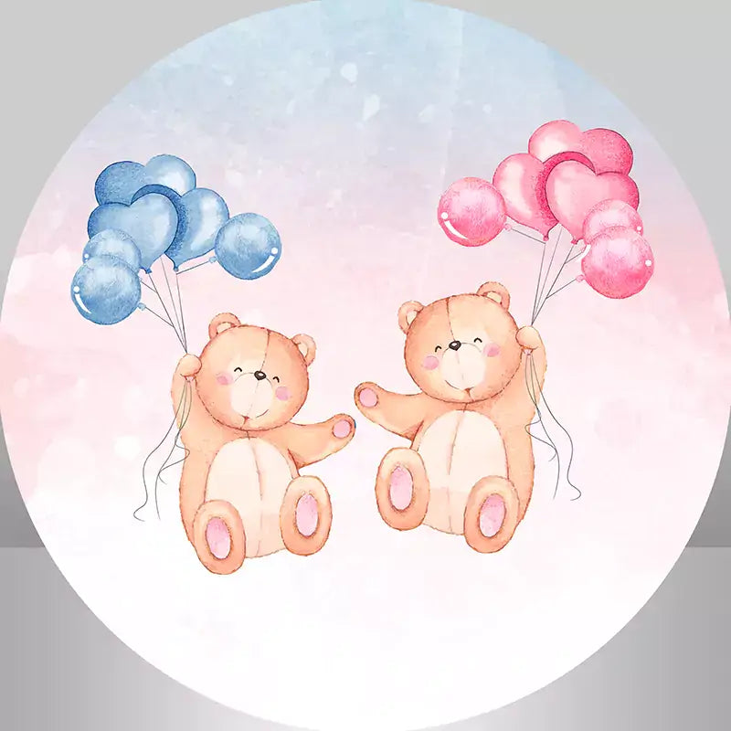 a round backdrop features two teddy bears holding pink and blue balloons respectively