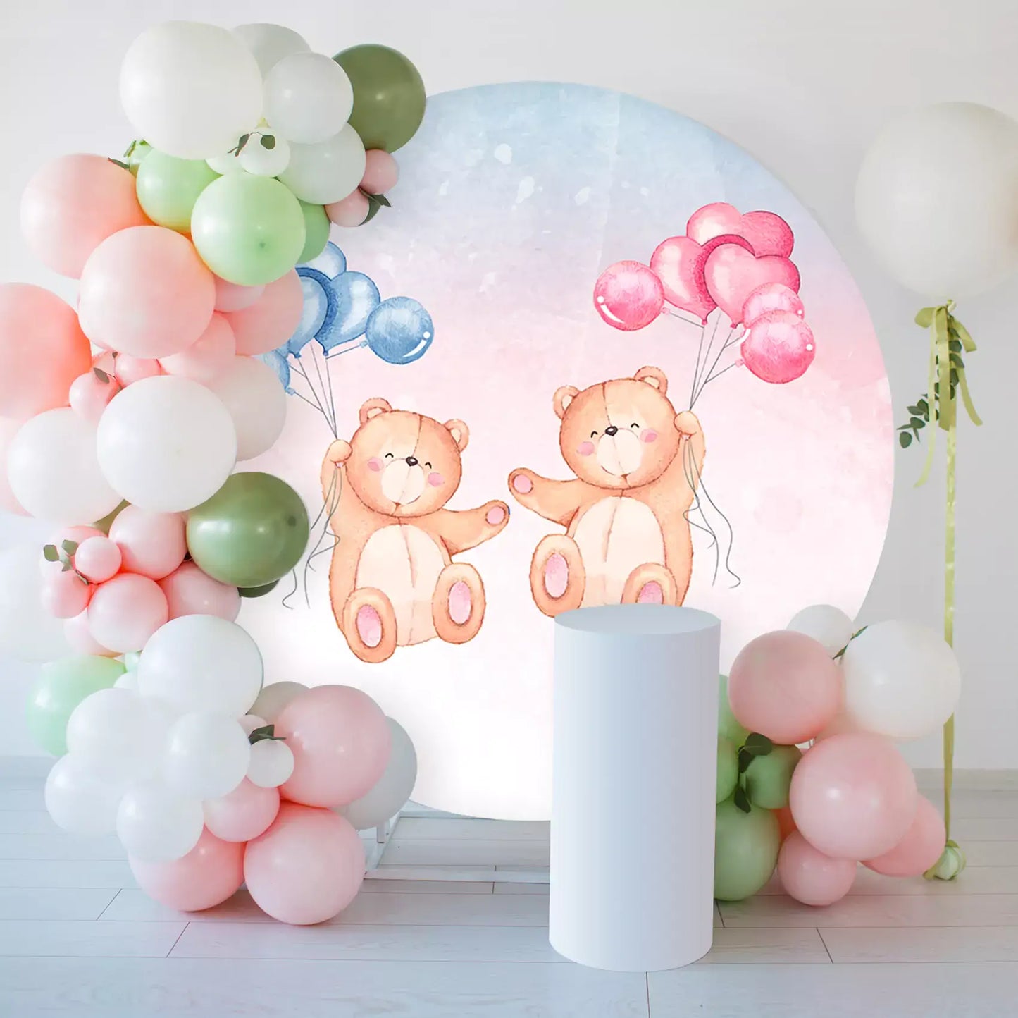 teddy bears hold pink and blue balloons round backdrop decorations