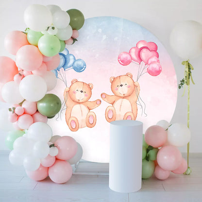 teddy bears hold pink and blue balloons round backdrop decorations