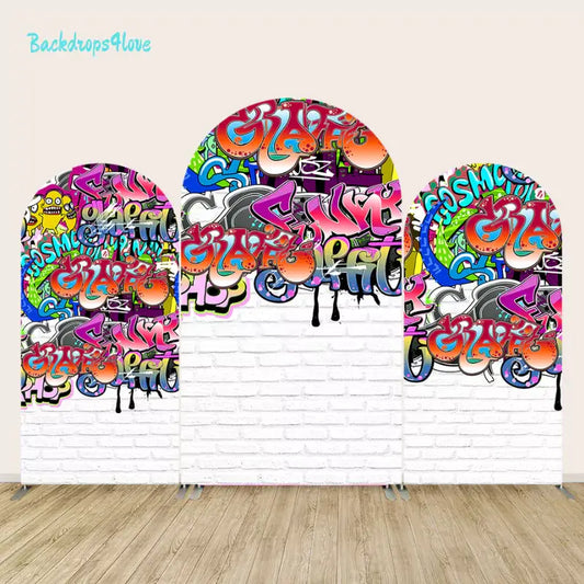 Three-panel backdrop set featuring vibrant graffiti designs on a white brick wall background, perfect for urban-themed events.