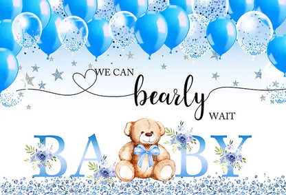 an adorable blue backdrop featuring 'We Can Bearly Wait' text, cute teddy bear, and balloons