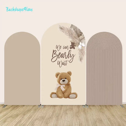 We Can Bearly Wait arch backdrop set featuring a cute teddy bear and neutral tones for baby shower decoration