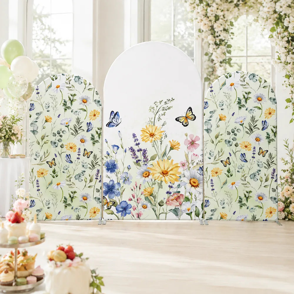 Three-piece wildflower butterfly arch backdrop covers set with watercolor daisies, blue and yellow flowers, botanical greenery and colorful butterflies.